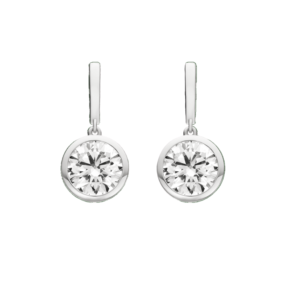 Pair of diamond earrings on a green background drop earrings in platinum single diamonds large