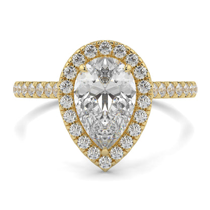 Gold ring with a pear-shaped diamond and smaller diamonds on a white  yb jewellers Pear engagement ring background