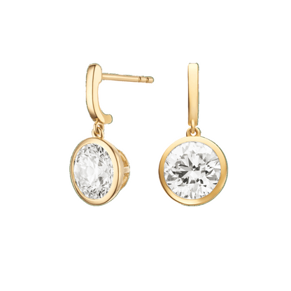 Gold earrings with clear gemstones on a green background  yb jewellers yellow gold diamond drop earrings rubover setting